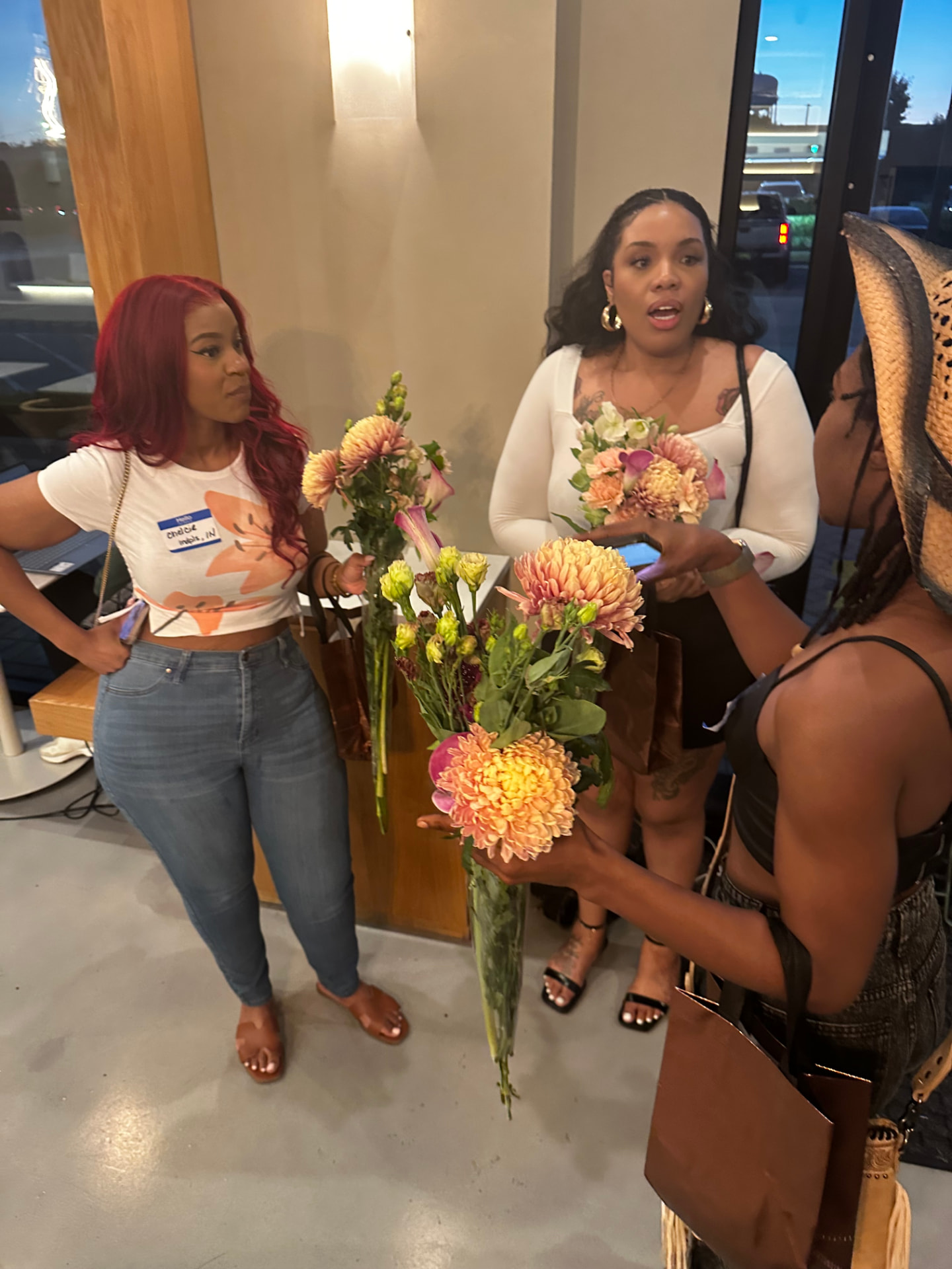 Guests choosing flower stems at the welcome bar